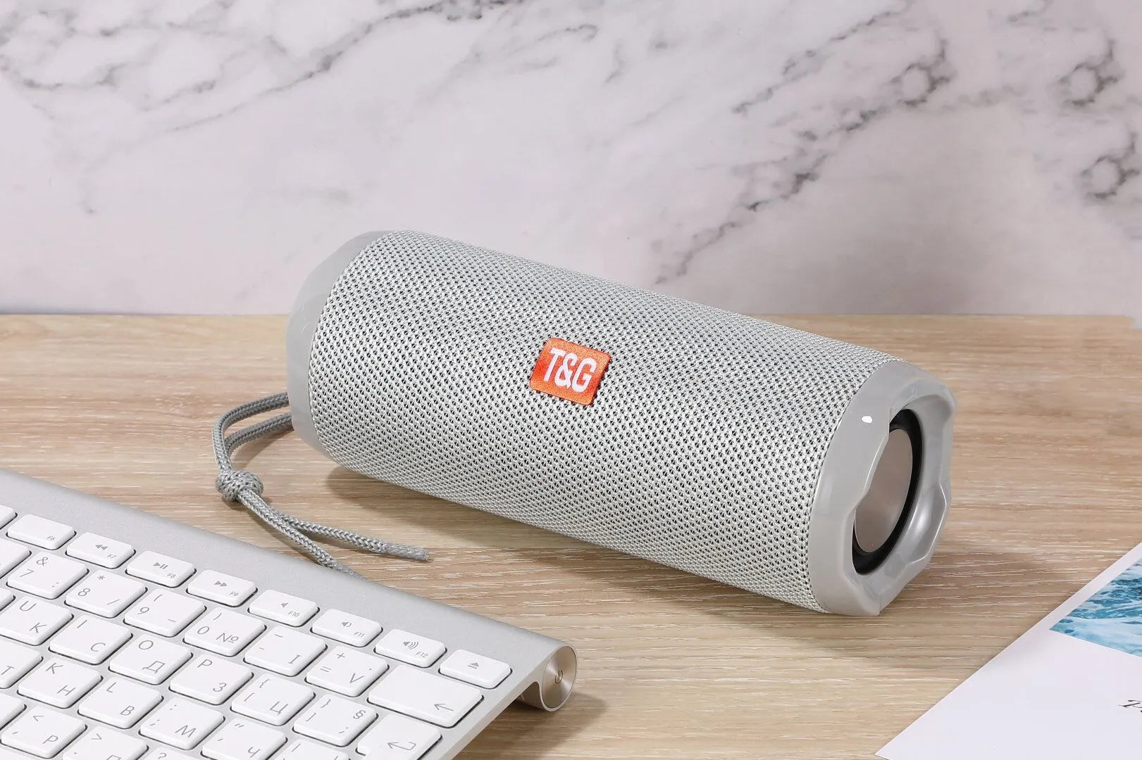 Fabric portable Bluetooth speaker with card holder in blue colour showing compact 182×73.5×69.2mm dimensions