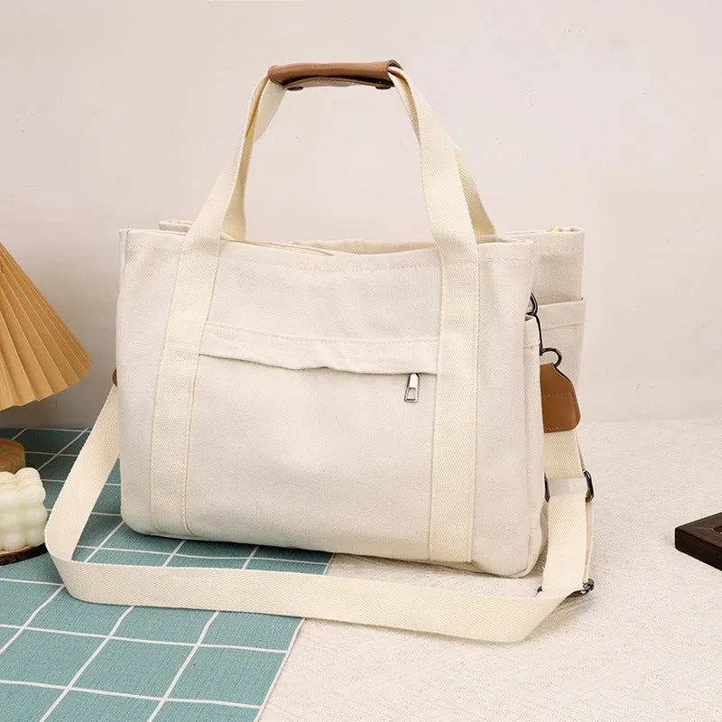 Large Capacity Canvas Tote Bag for Women with Multiple Internal Pockets for Laptop, Tablet, and Documents in a Practical Square Shape, Available in Army Green, Black, Khaki, or White for Daily Use
