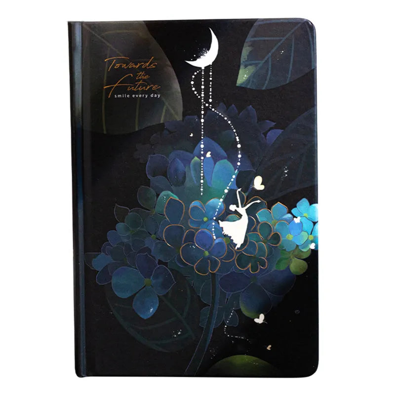 A5 notebook with luminous cover in Deep Blue, open to show 100 gsm paper and colour illustrations