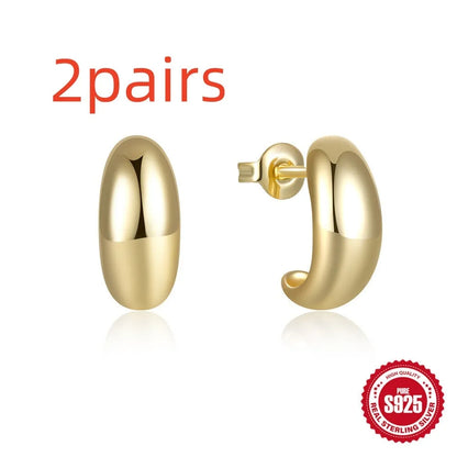C-shaped sterling silver earrings with glossy electroplated finish in gold or white gold options