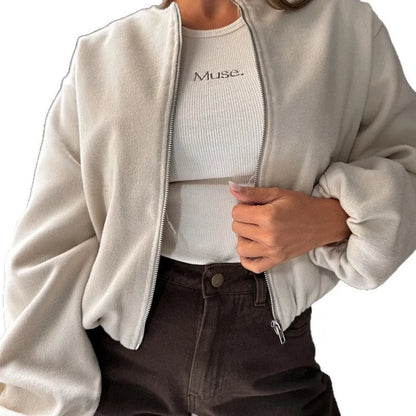Brown women's off-shoulder short coat with lantern sleeves and pockets on a hanger.