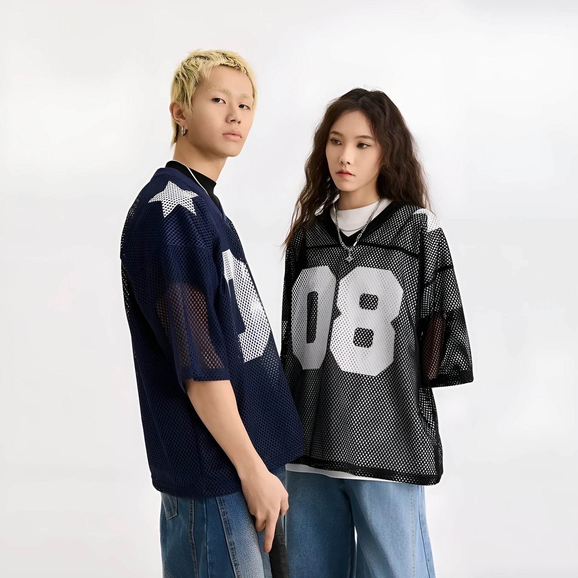 Black loose fit half sleeve shirt with a white letter print, laid flat.