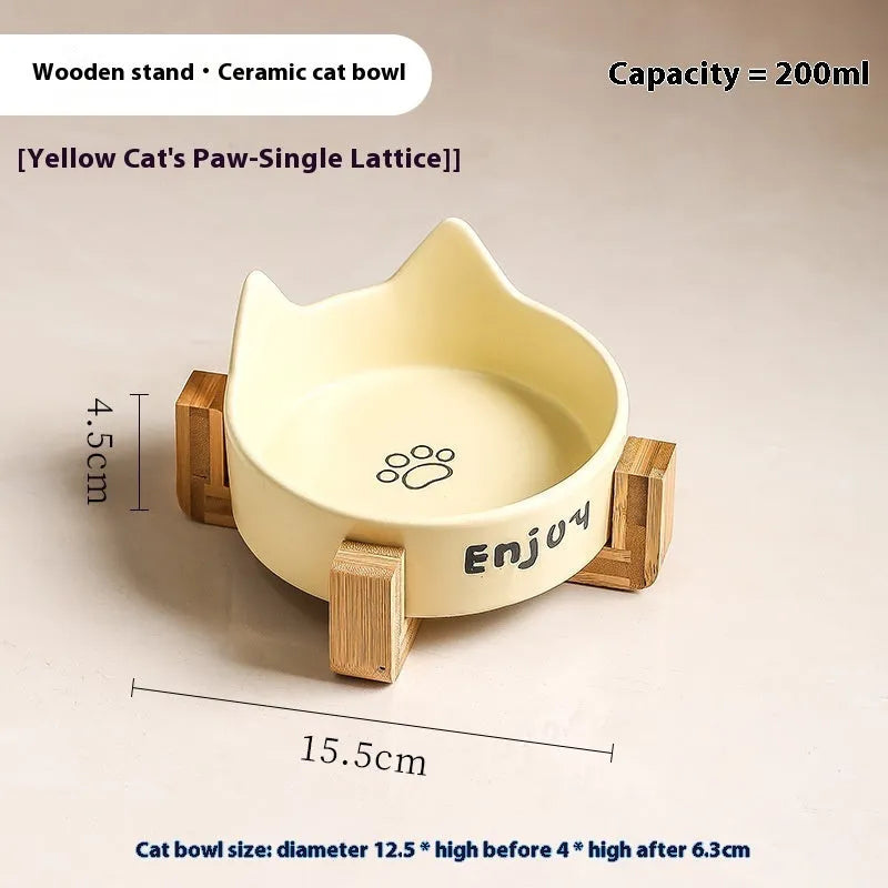 Porcelain cat bowl with anti-tumble wooden frame in pink with a cat paw design