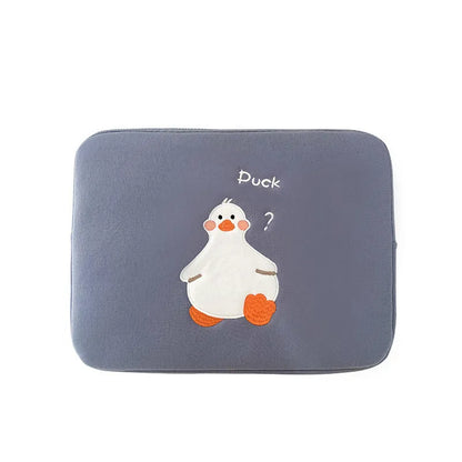 Blue tablet case with embroidered cartoon duck design showing zipper closure and cotton fabric texture