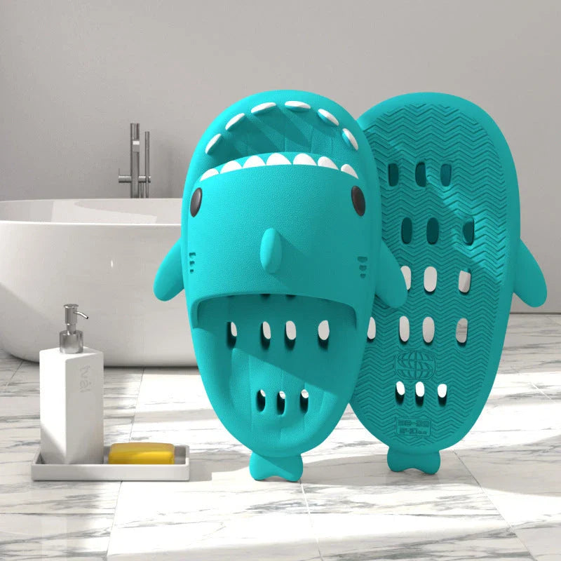 Colorful shark-themed shower slides with drainage holes, designed for comfortable and practical use in the pool or shower.