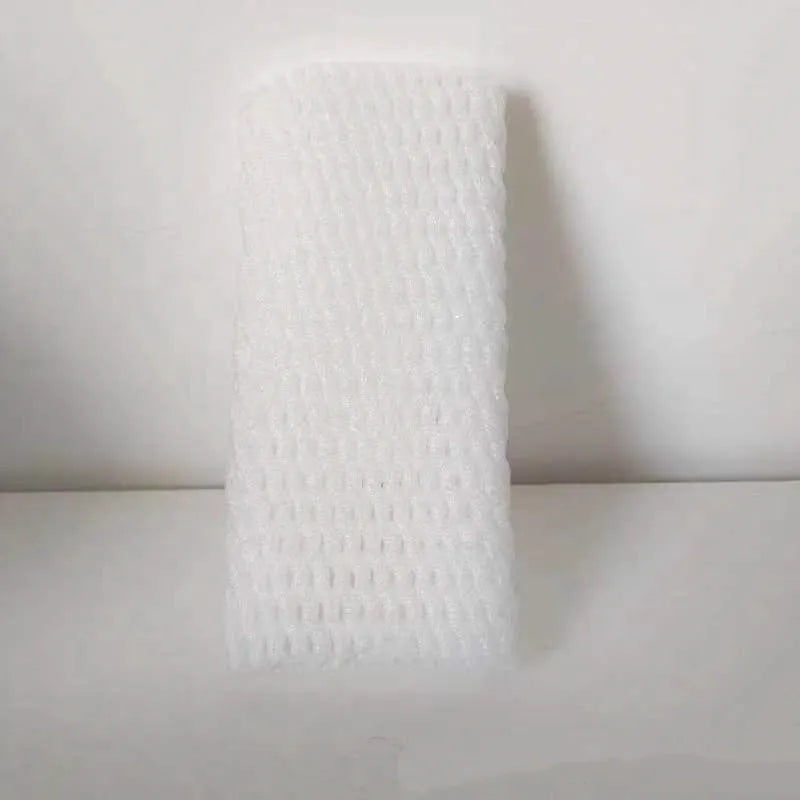 A white foam protective net sleeve stretched open, showing its simple tubular construction.