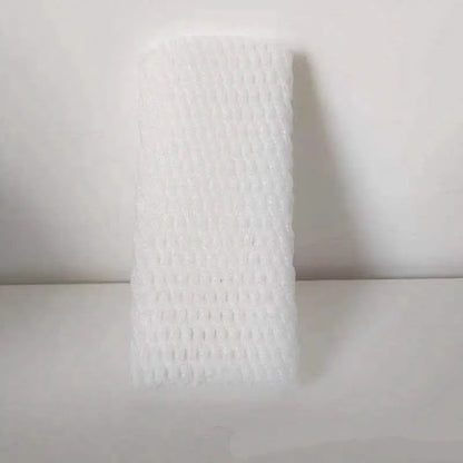 A white foam protective net sleeve stretched open, showing its simple tubular construction.