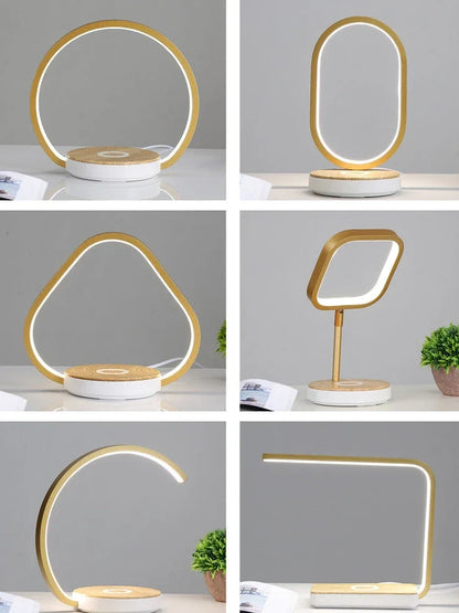 Modern bedside lamp with wireless charging pad and adjustable LED lighting in gold finish