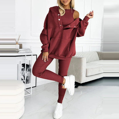Women's 3-piece sports suit featuring a hooded sweatshirt with pockets and slim trousers