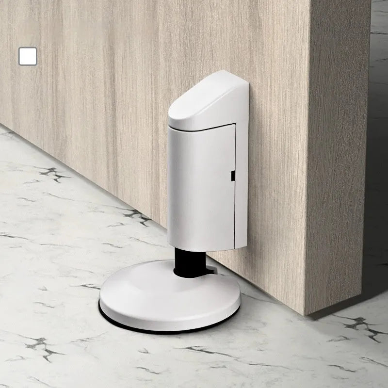 Door stopper made from zinc alloy featuring a low-profile modern design in multiple finishes including brushed gold and brushed nickel for discreet home installation.