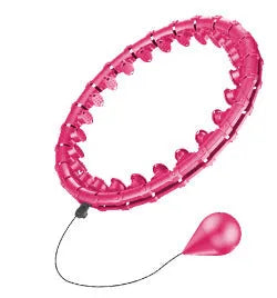Pink massage soft ball with a detachable black belt, shown on a fitness mat.