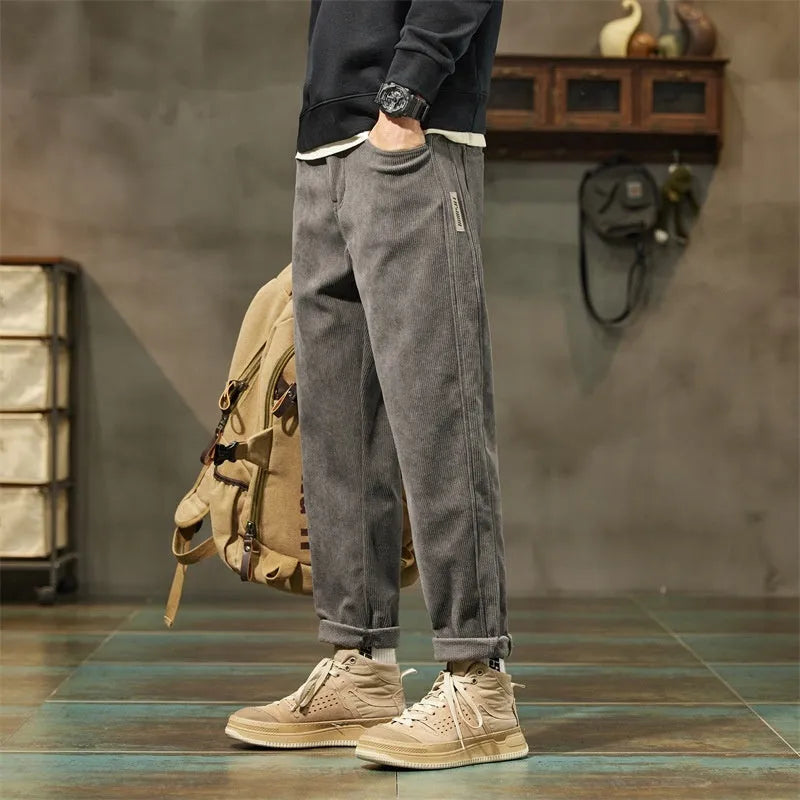 Men's straight-leg corduroy pants in army green colour with tapered fit and mid waist design