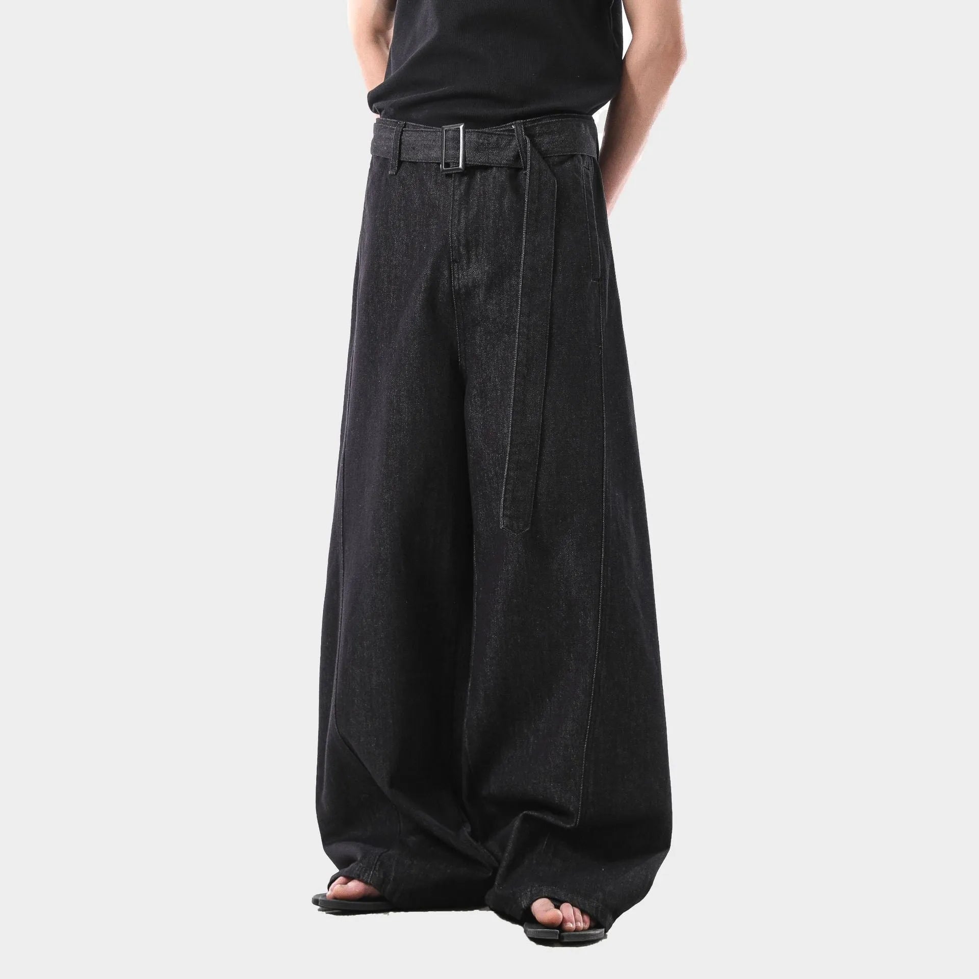 Black high-waist straight-leg jeans with zip placket fly, made from cotton denim fabric