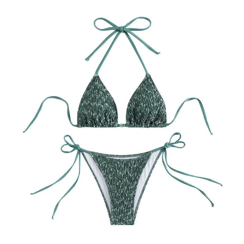 Women's green halterneck swimsuit with backless design and matching shorts