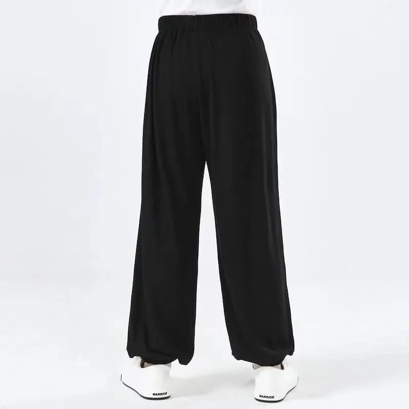 Children's high elasticity martial arts practice pants for Sanda in black, red, or white colours.