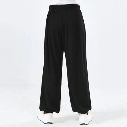 Children's high elasticity martial arts practice pants for Sanda in black, red, or white colours.