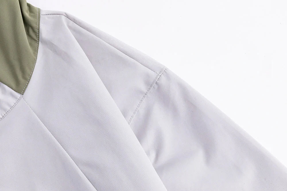 Military Green Assault Suit for outdoor adventures, durable and comfortable with multiple pockets.