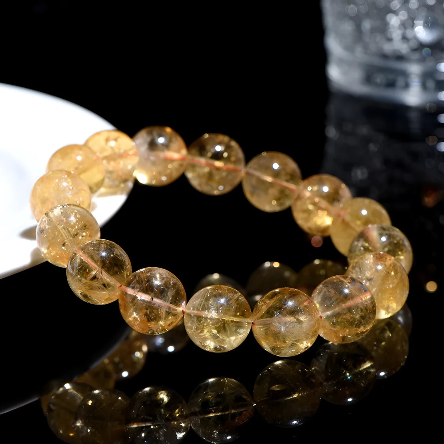 Natural yellow citrine bracelet with geometric beads in various sizes from 4mm to 20.8mm diameter on wrist