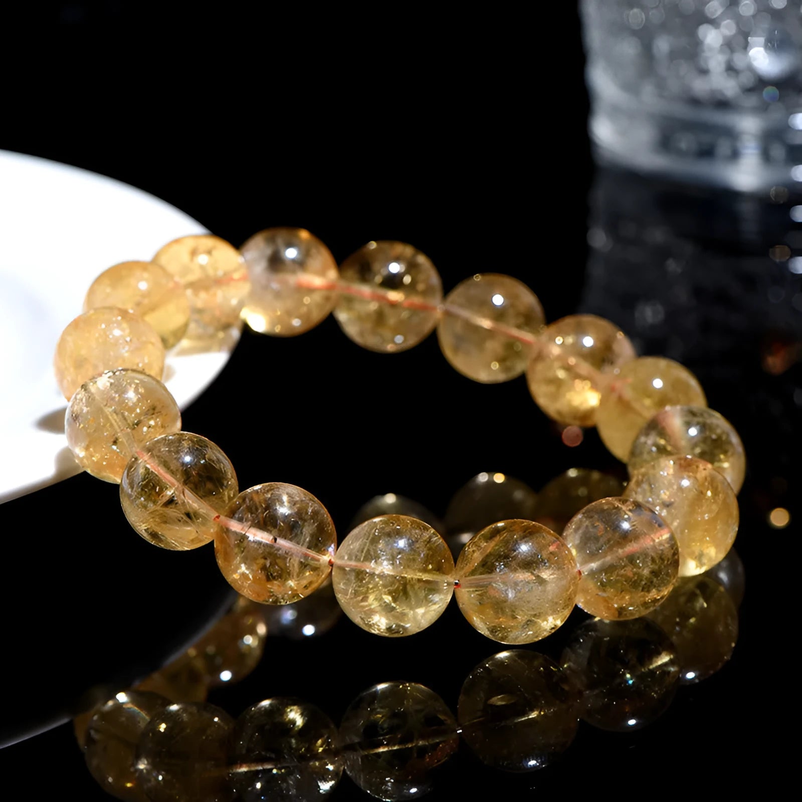 Natural yellow citrine bracelet with geometric beads in various sizes from 4mm to 20.8mm diameter on wrist