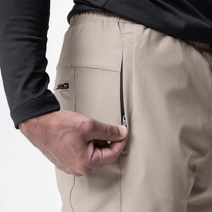 Men's grey fitness trousers with ankle ties, made from quick-drying polyester, for exercise and casual use.