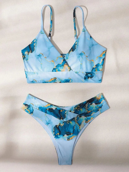 Women's high-waist bikini set with U-neck top in a blue marble tie-dye print.