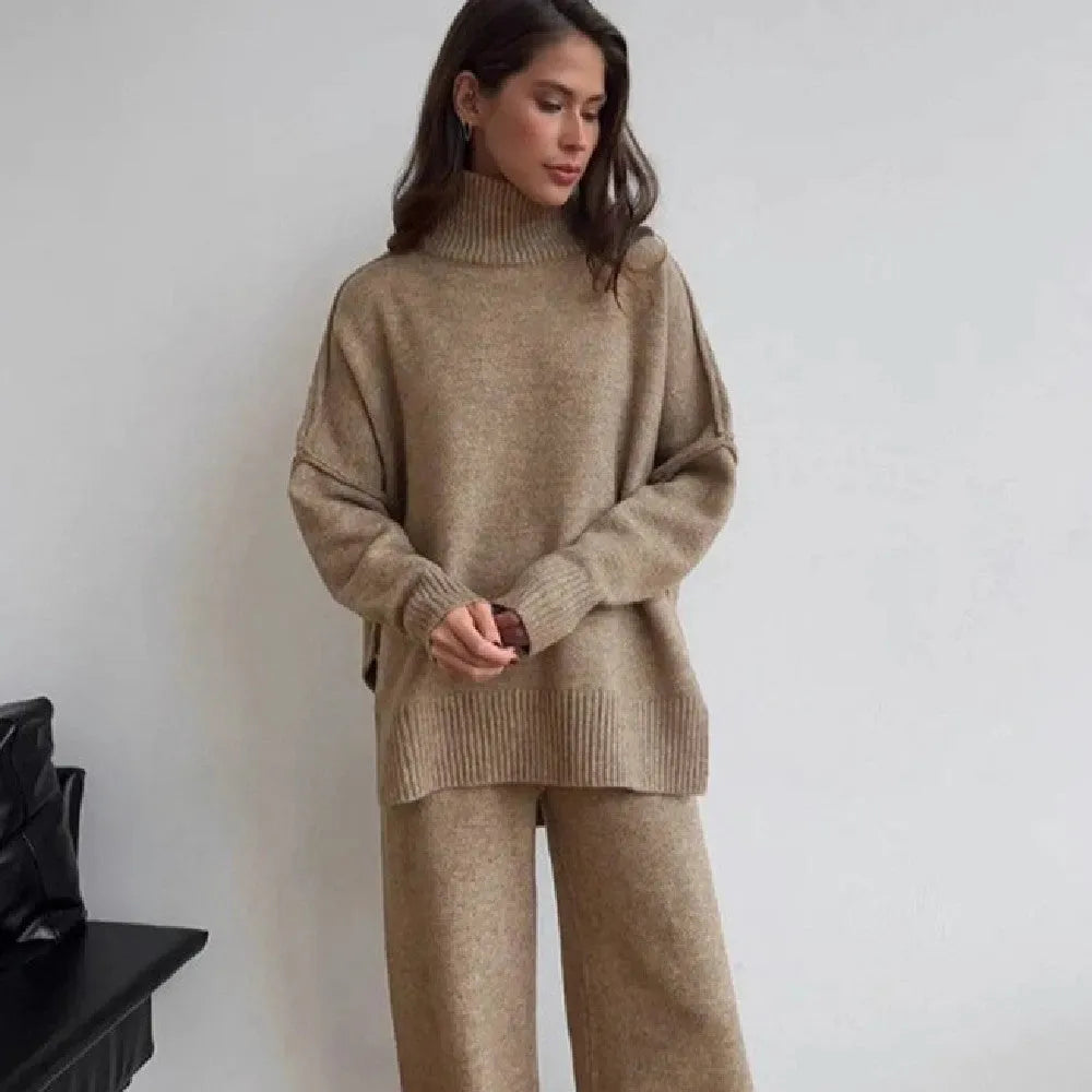 Women's acrylic side-slit sweater suit in dark grey, featuring a top and trousers for a coordinated two-piece set.