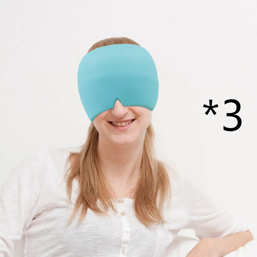 Black elastic gel headache relief mask laid flat showing eye contours and adjustable headband.