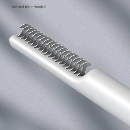 Stainless steel dog dematting comb with ergonomic handle, shown in pink colour on a white background.