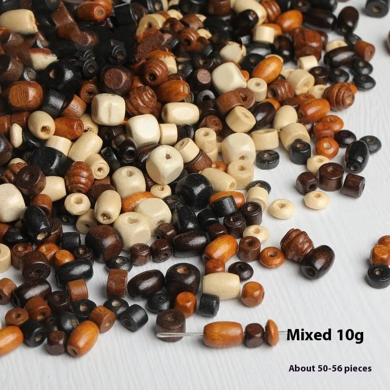 Mixed vintage solid wood beads scattered for DIY jewellery making and craft projects
