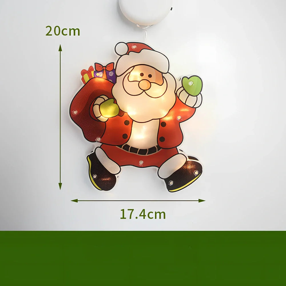 LED Christmas hanging lights with suction cups showing snowman design illuminated on window