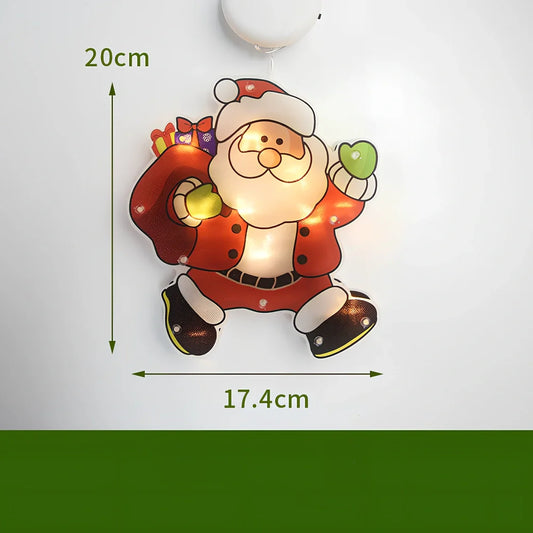LED Christmas hanging lights with suction cups showing snowman design illuminated on window