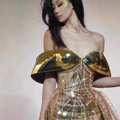 Gold strapless sequined tulle dress with thigh-high split and floor-length skirt