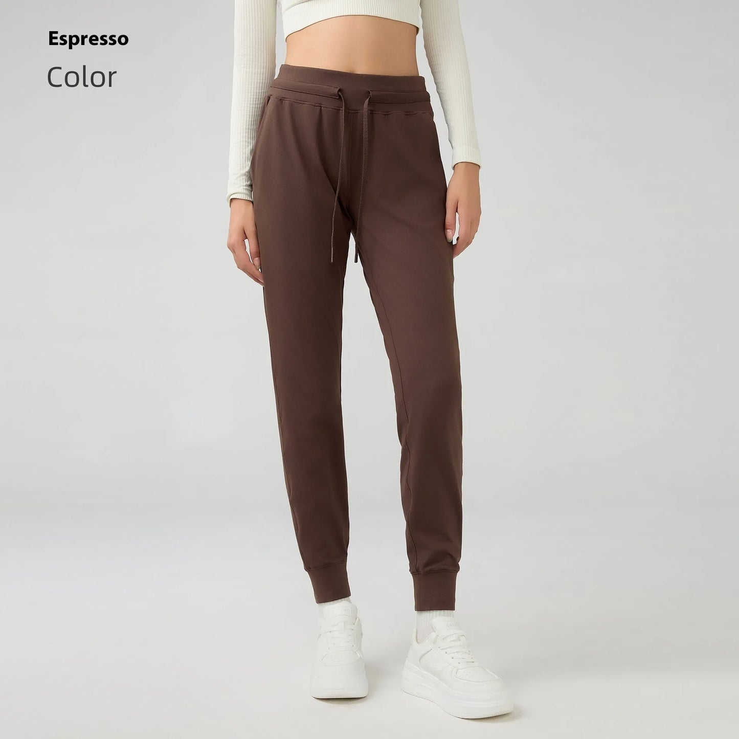 Women's high waist yoga pants with drawstring waistband in Belgian blue colour, showing stretch fabric during yoga pose