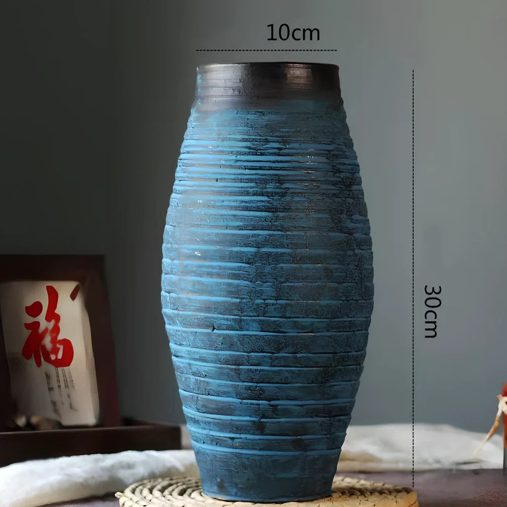 Ceramic mosaic vase with dried flowers, showing mosaic pattern and 25cm height