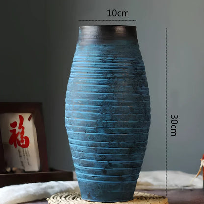 Ceramic mosaic vase with dried flowers, showing mosaic pattern and 25cm height