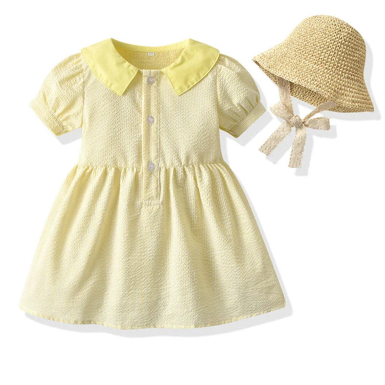 Girl wearing yellow plaid princess cotton dress with matching lace straw hat summer set