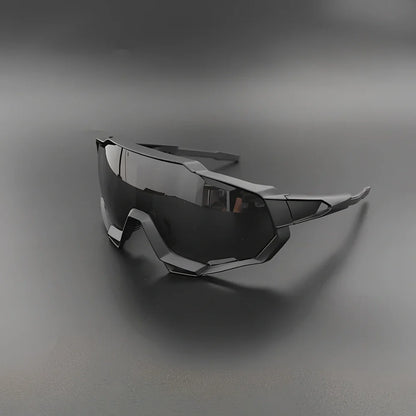Cycling glasses with interchangeable lenses showing UV400 protection and lightweight frame design