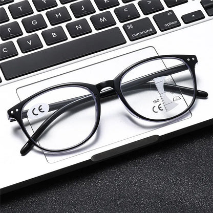 Women's multi-focus presbyopic glasses with adjustable nose pads and spring hinges in black and blue frame