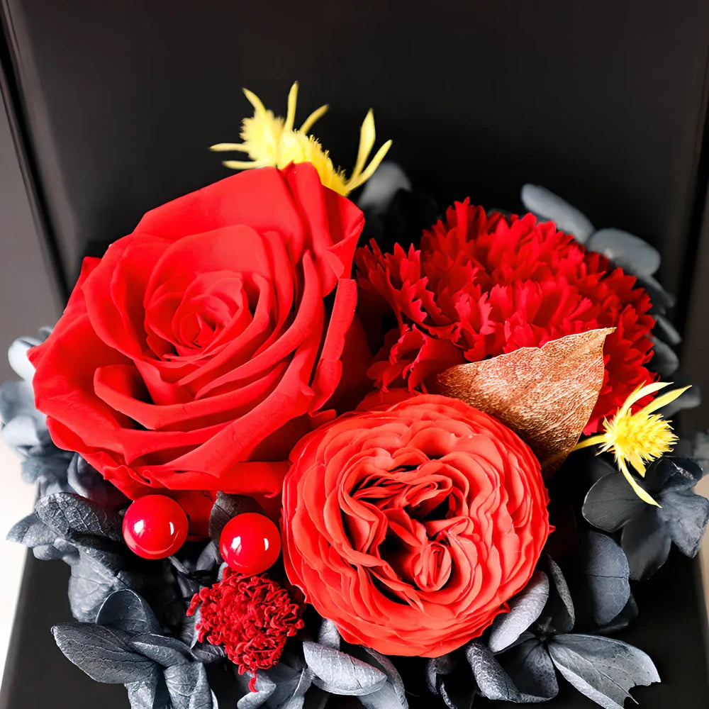 Preserved eternal flower gift box with roses, carnations, and hydrangea in red and pink colours