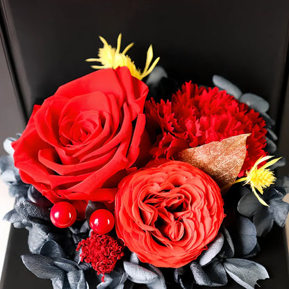 Preserved eternal flower gift box with roses, carnations, and hydrangea in red and pink colours