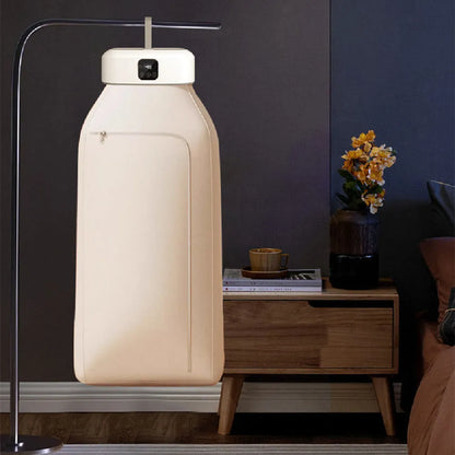 White cylindrical compact laundry dryer with remote control, dimensions 29x22x10cm, foldable for storage