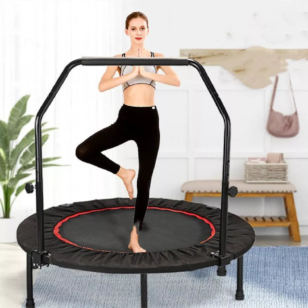 Red and black indoor trampoline with optional safety handrail for kids and adults