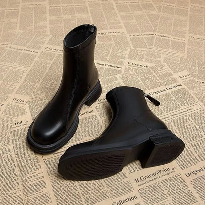 Women's black thick heel ankle boots with back zipper and round toe on flat rubber sole