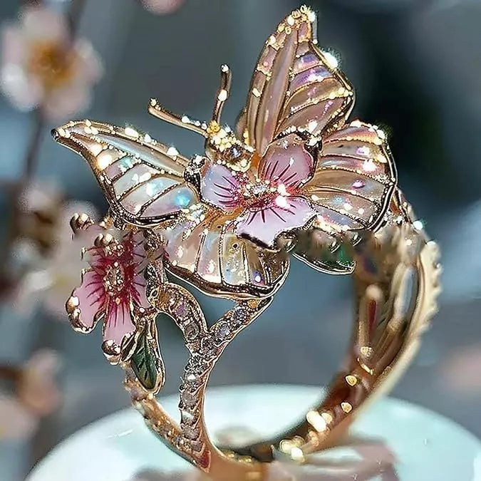 Adjustable crystal butterfly flower ring in gold, silver, and rose gold finishes