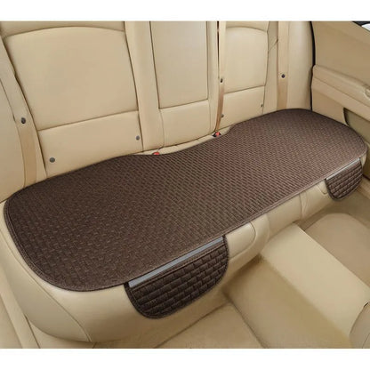 Linen car cushion with plaid pattern in cream colour on automotive seat