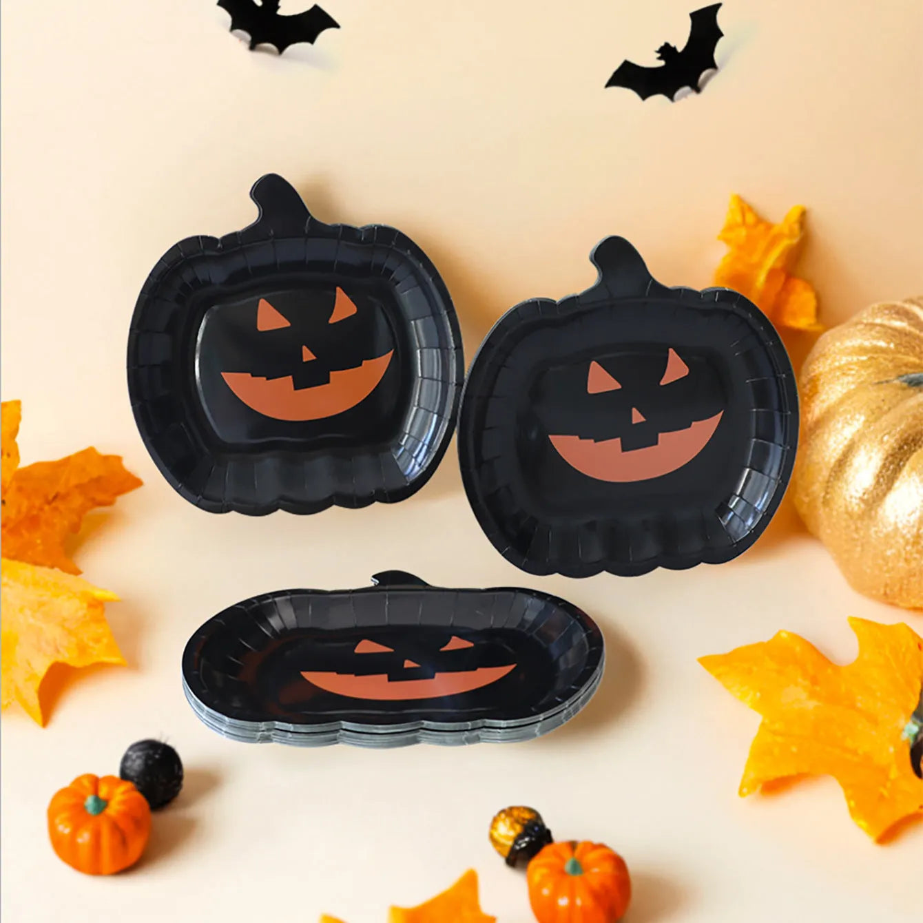 Black pumpkin design disposable paper plates for Halloween, 9-inch diameter