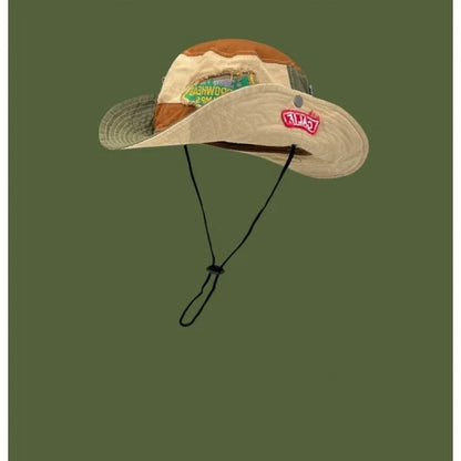 Army green cotton foldable fisherman hat with flat top crown and hand-painted patchwork design