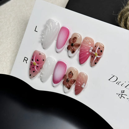 Hand-painted 3D carved nail art patches showing embossed and candy patterns on an almond-shaped nail.