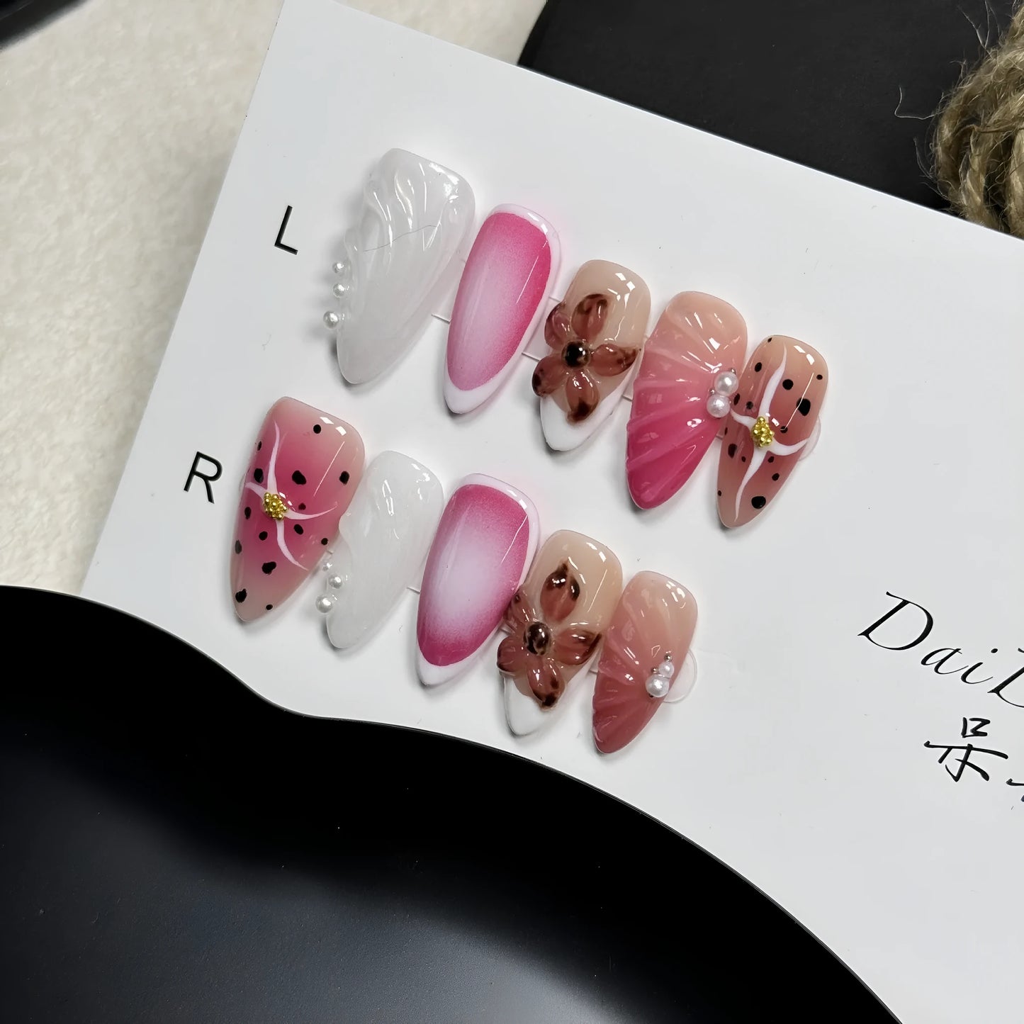 Hand-painted 3D embossed nail art patches in almond shape, showing candy and textured patterns.