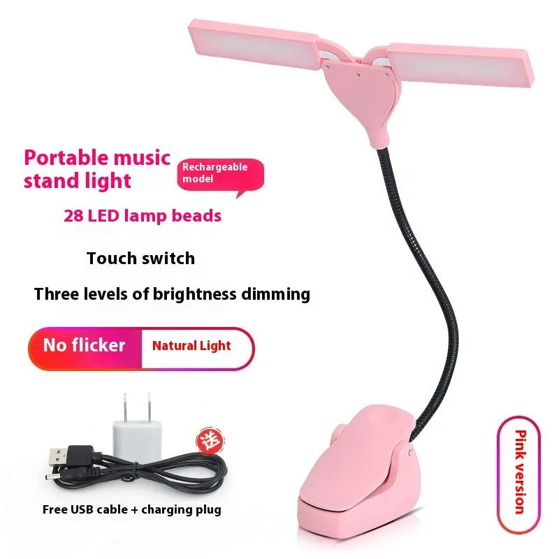Black music stand light with flexible neck attached to metal music stand, illuminating sheet music
